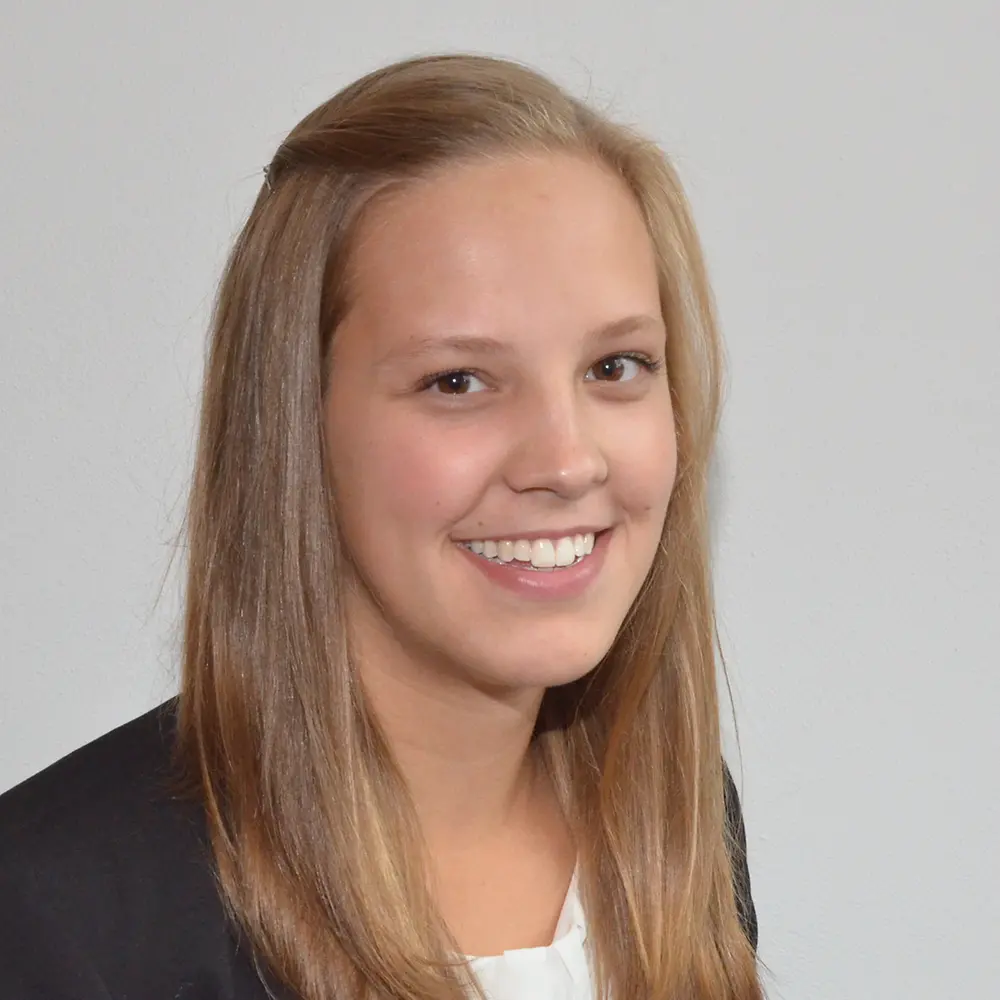 Jasmin Ingwersen, R&D product developer at Henkel, smiles into the camera.