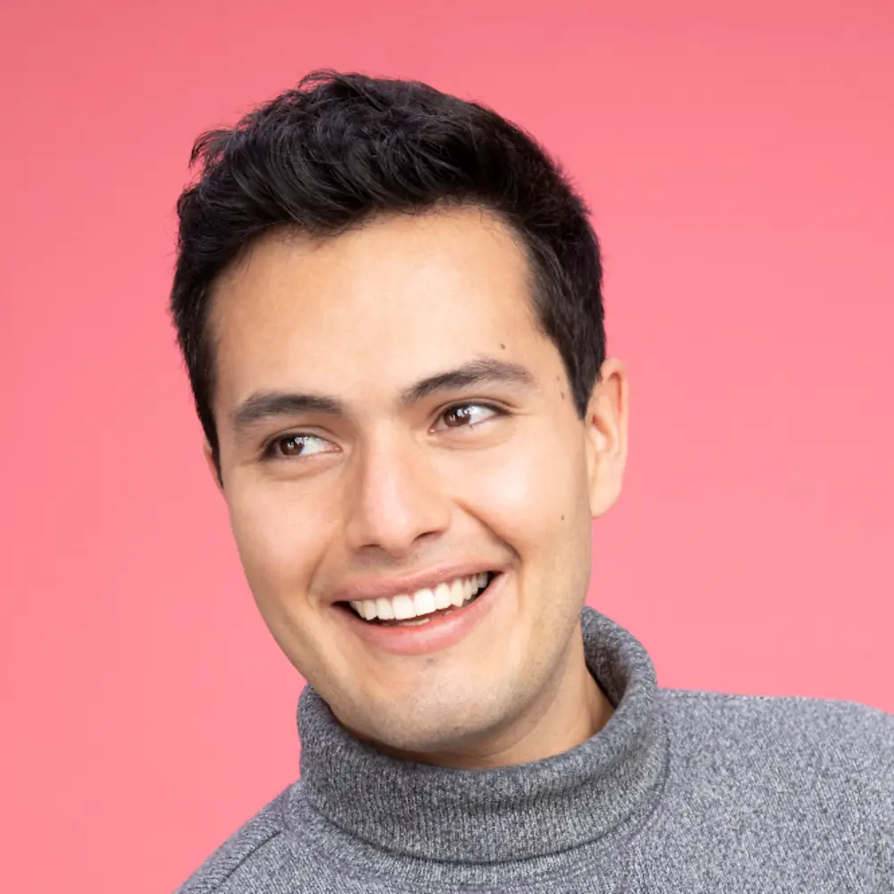 A portait photo of Luis Valadez that shows him smiling.